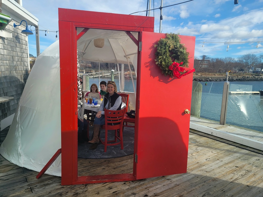 Private dining igloos at Mile Marker One restaurant deck were designed by General Manager Patrick Hurd based on principles used to shrink wrap boats. The festive doors were added not just for their quirky adorableness but also to creat easier access for waitstaff. Photo (c) Alison Colby-Campbell